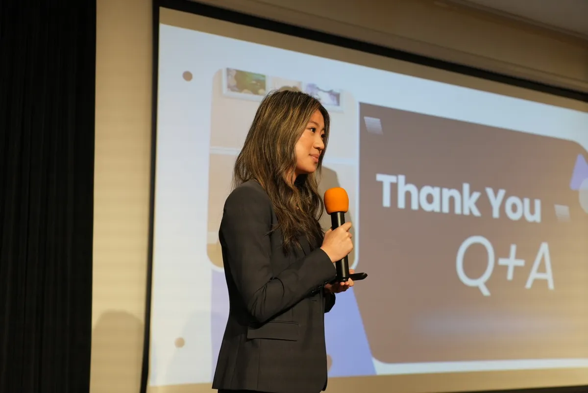 Ellen Zhang answering questions from the judges.